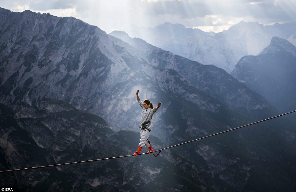 Highliners sleep in hammocks suspended over Italian Alps