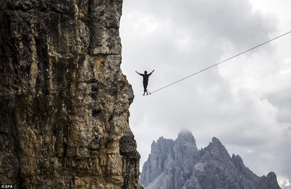 Highliners sleep in hammocks suspended over Italian Alps