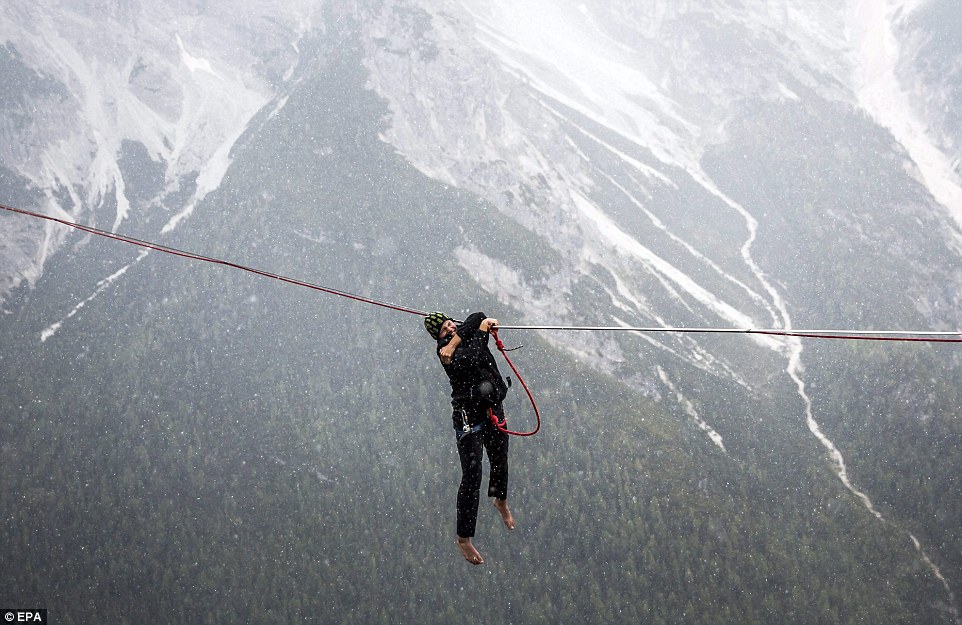 Highliners sleep in hammocks suspended over Italian Alps