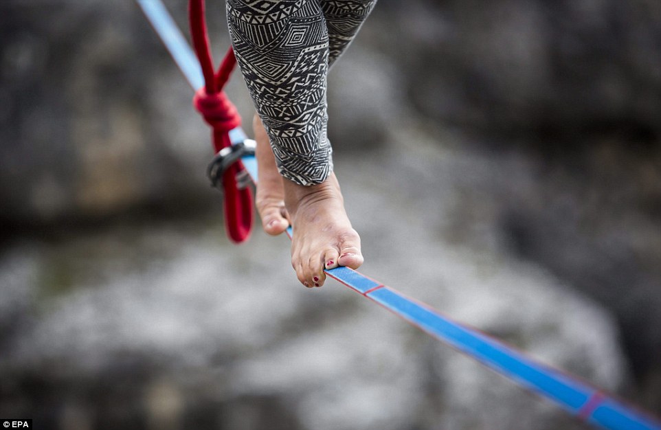 Highliners sleep in hammocks suspended over Italian Alps