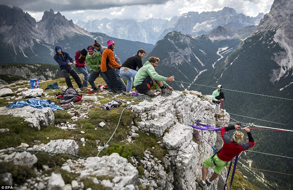 Highliners sleep in hammocks suspended over Italian Alps