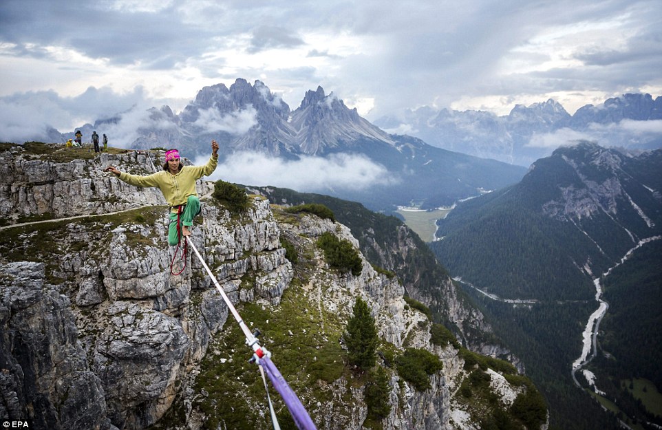 Highliners sleep in hammocks suspended over Italian Alps